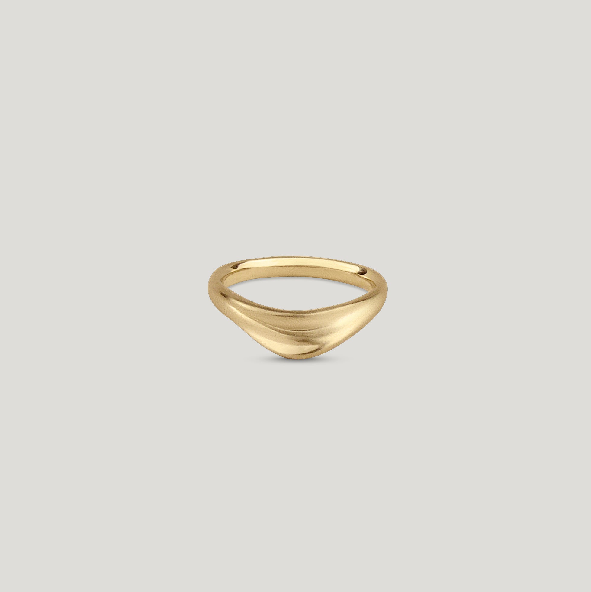 Curved dune gold wedding ring with organic texture