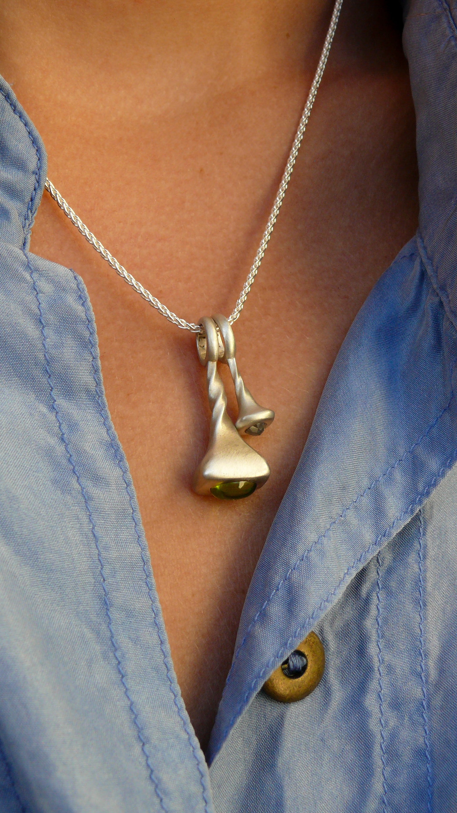 Peridot-Pendulum-Charm-No.7-Silver-on-model-with-diamond