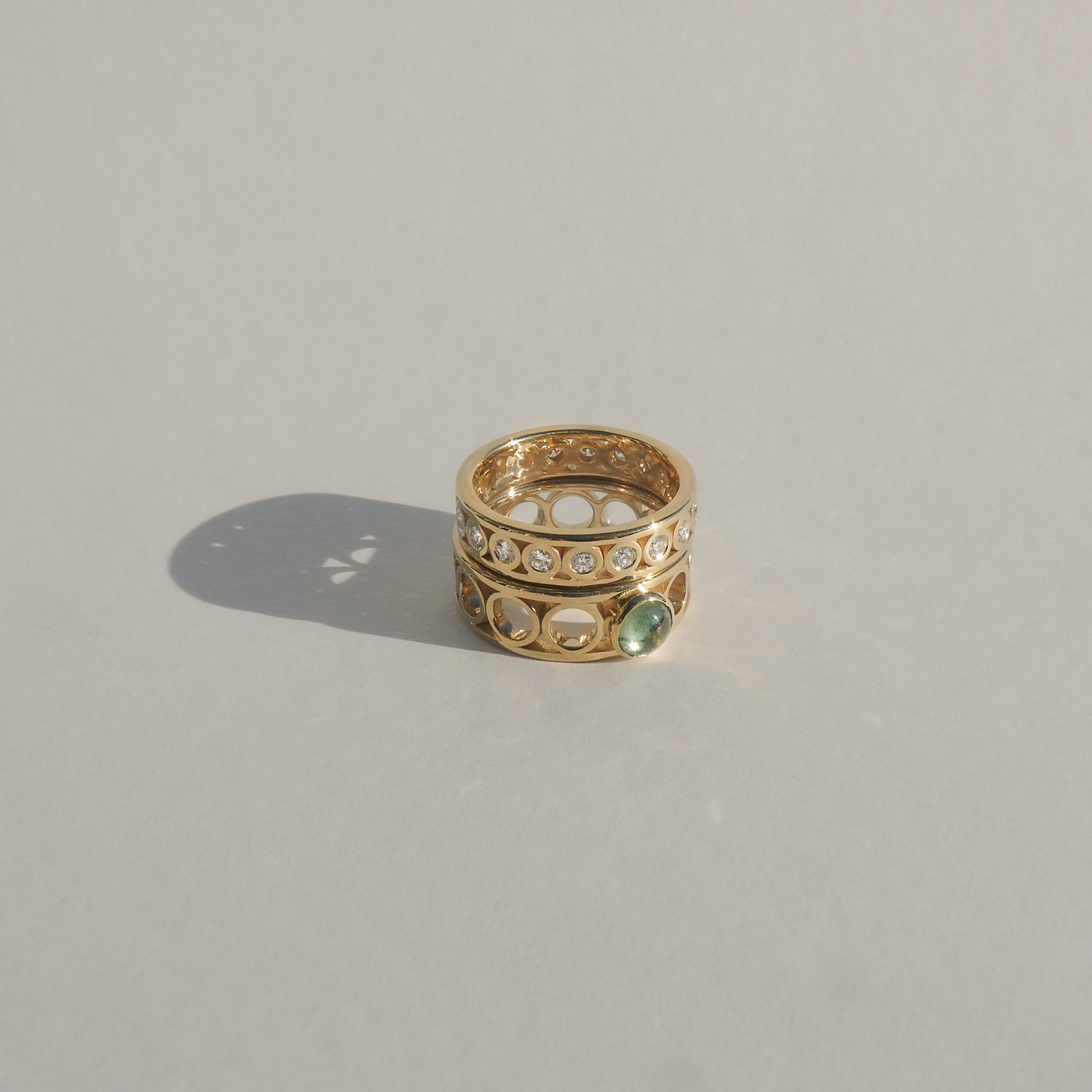 2mm recycled white diamonds flush set in a 14k yellow recycled gold eternity ring