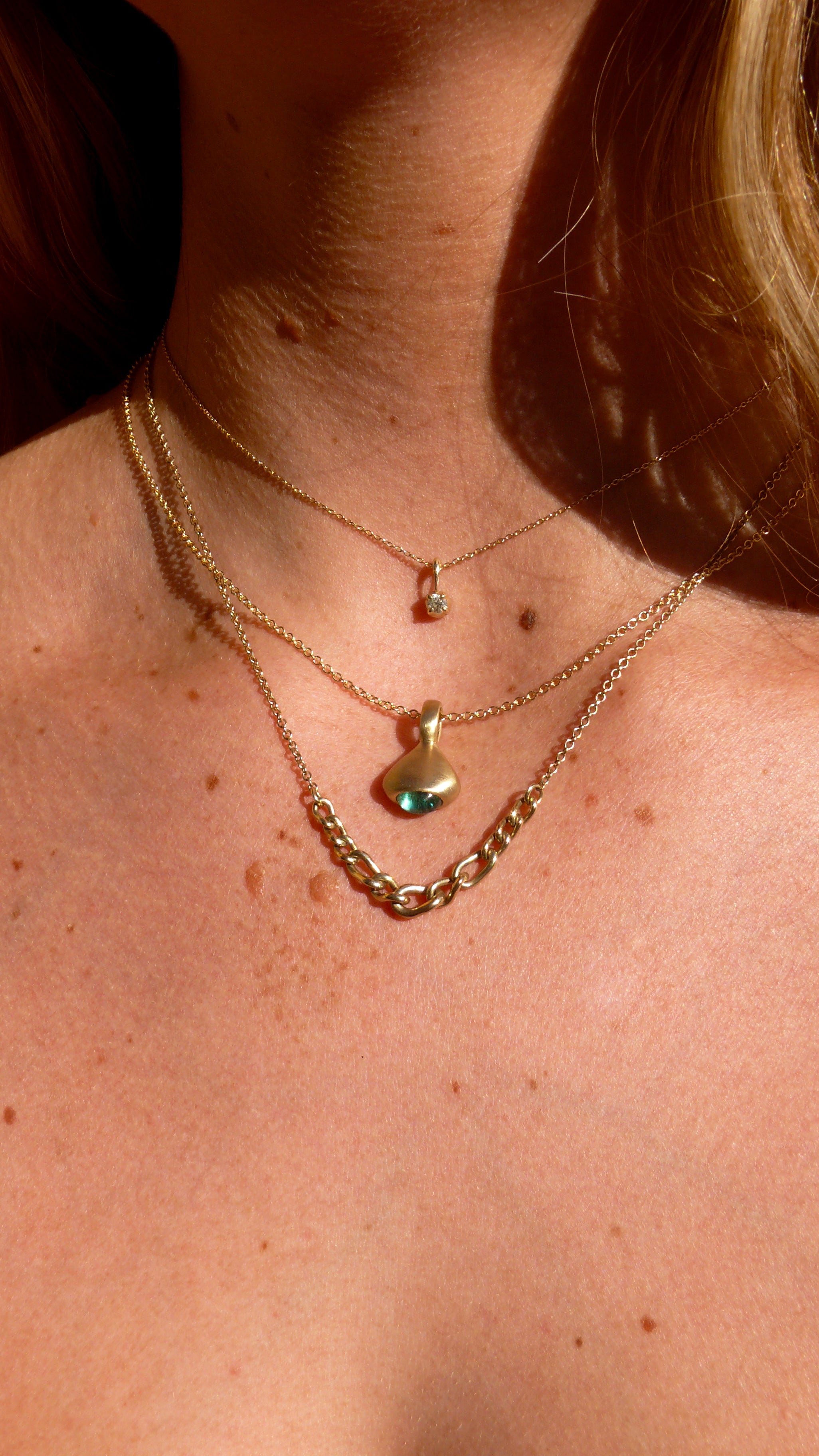 One-of-a-Kind Gold Teal Tourmaline Pendulum Charm No. 3, diamond blossom charm, graduated curb chain necklace on model