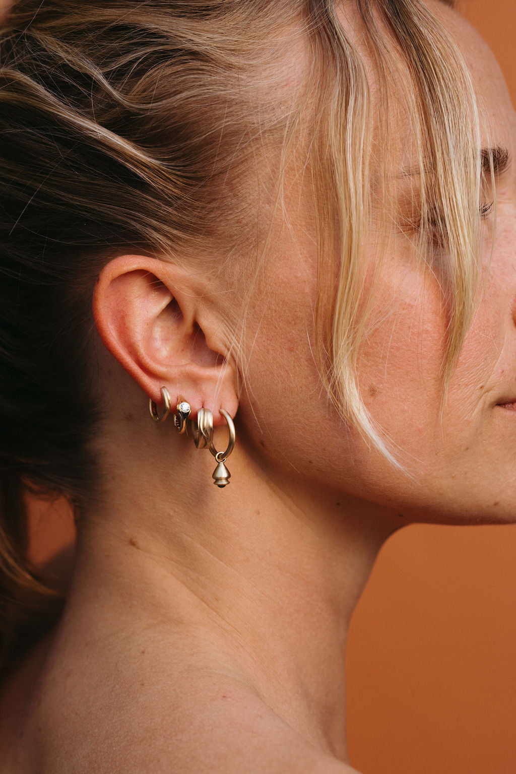 Diamond Petite Signet Clicker Huggie Hoop - Gold in earring stack with hoop earrings