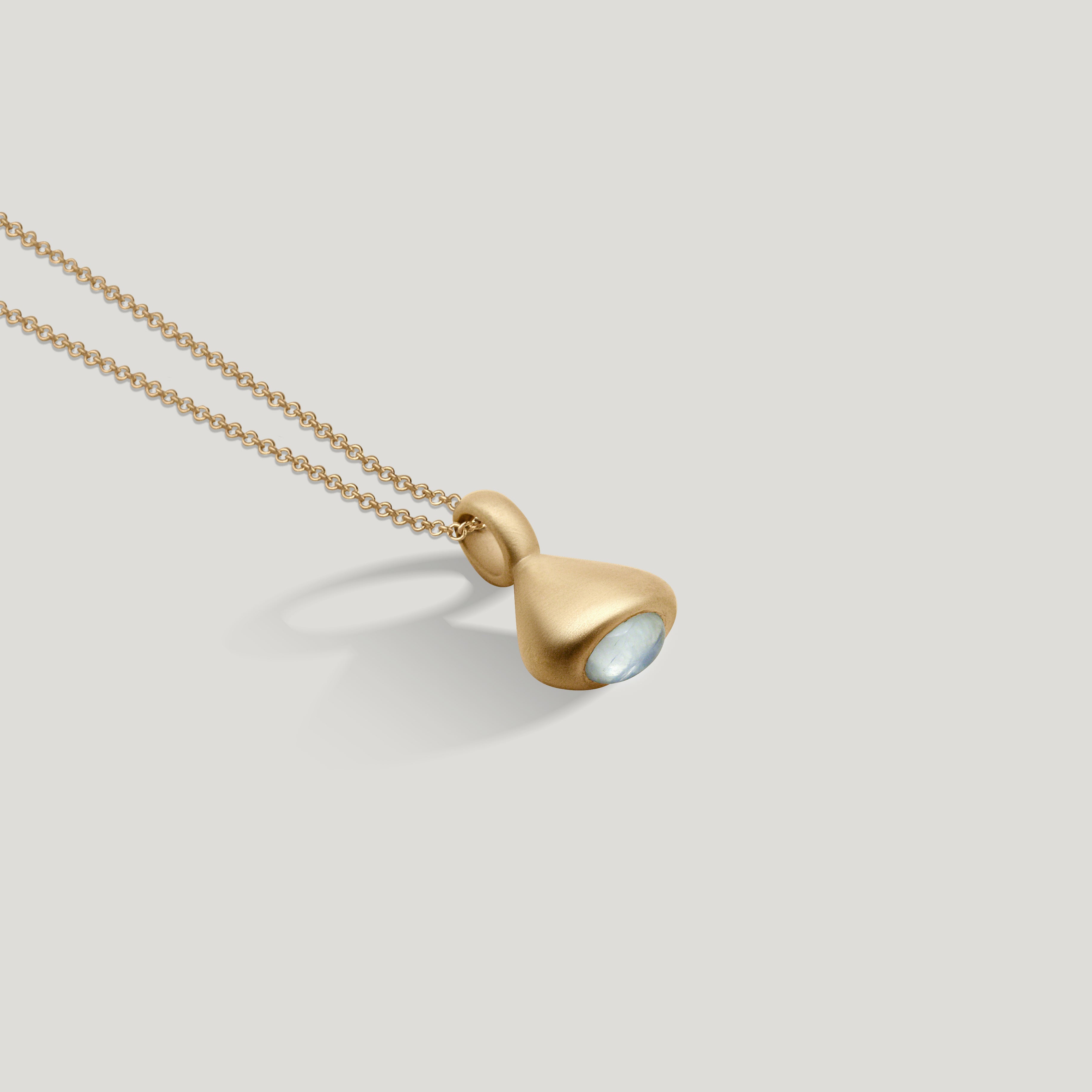 gold moonstone pendulum charm no. 3 on 1.5mm cable chain on grey background