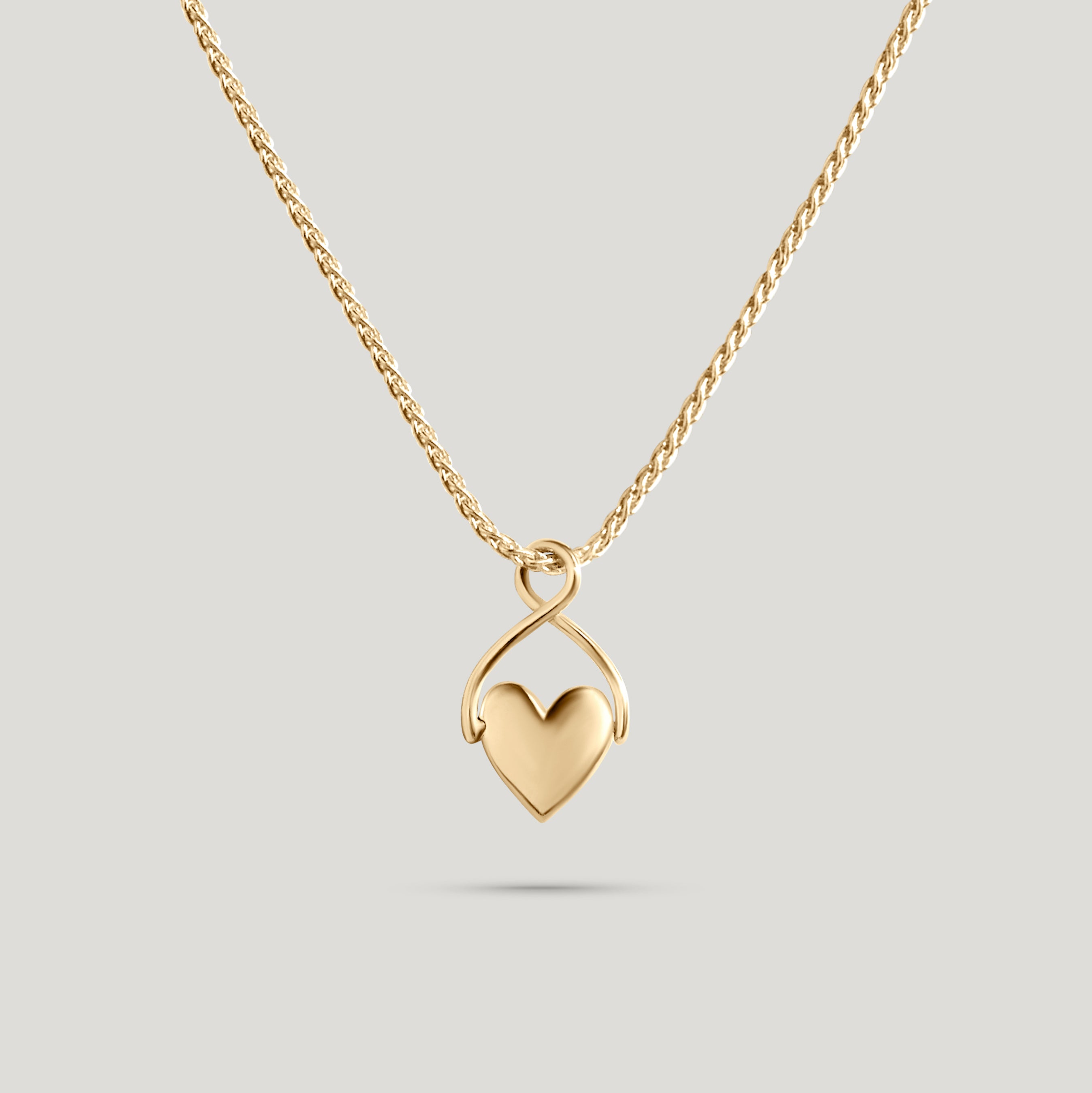 Spinning Heart Charm 14k solid yellow gold on heritage wheat chain