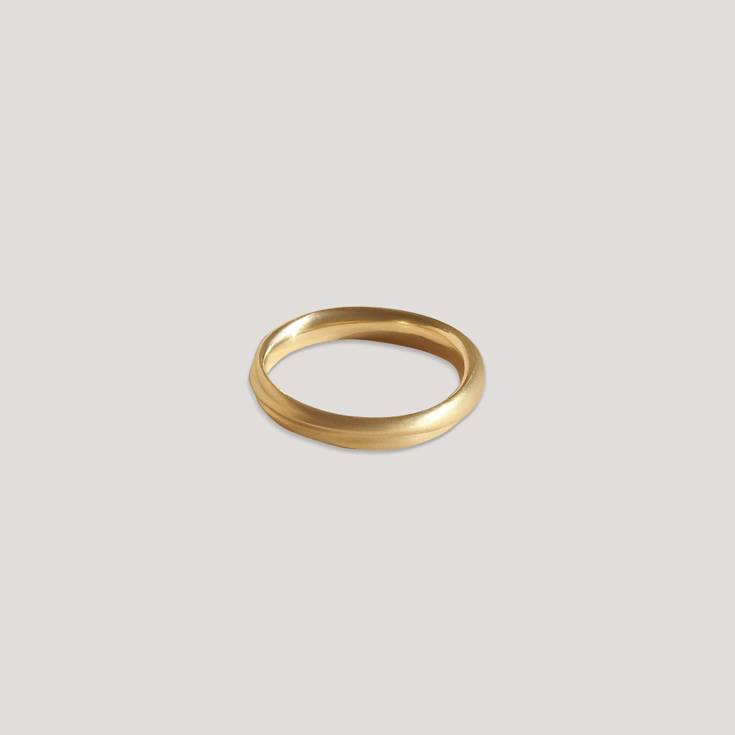 narrow dune ring on neutral background