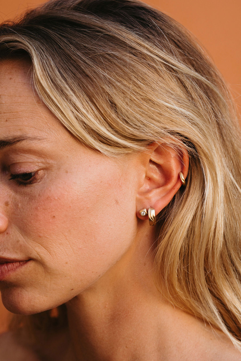 Narrow Dune Clicker Huggie Hoop - Gold earring stack