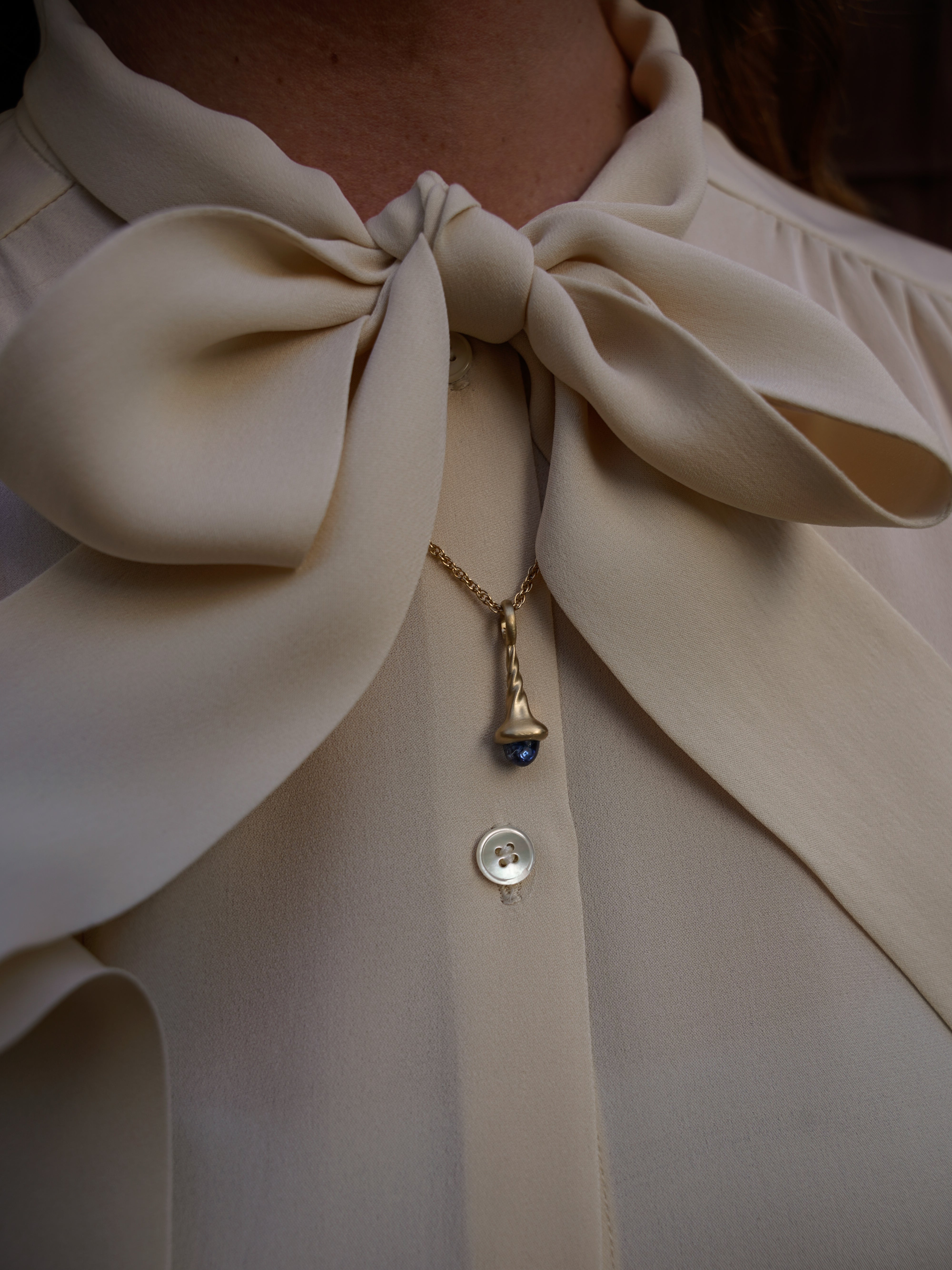 Okay Fine Gold Pendulum Charms On Model Large Blue Sapphire