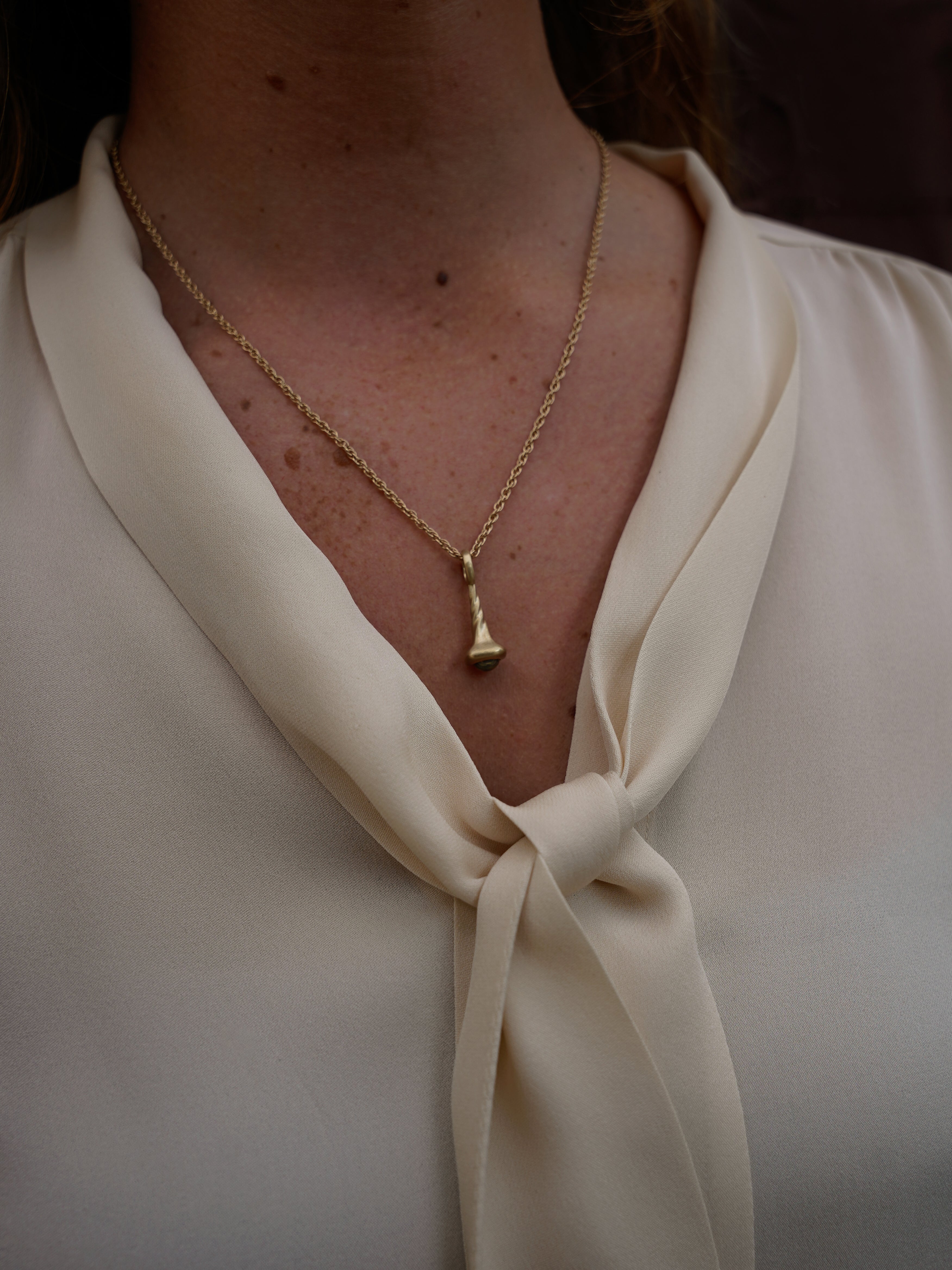 Okay Fine Gold Pendulum Charms On Model Peridot