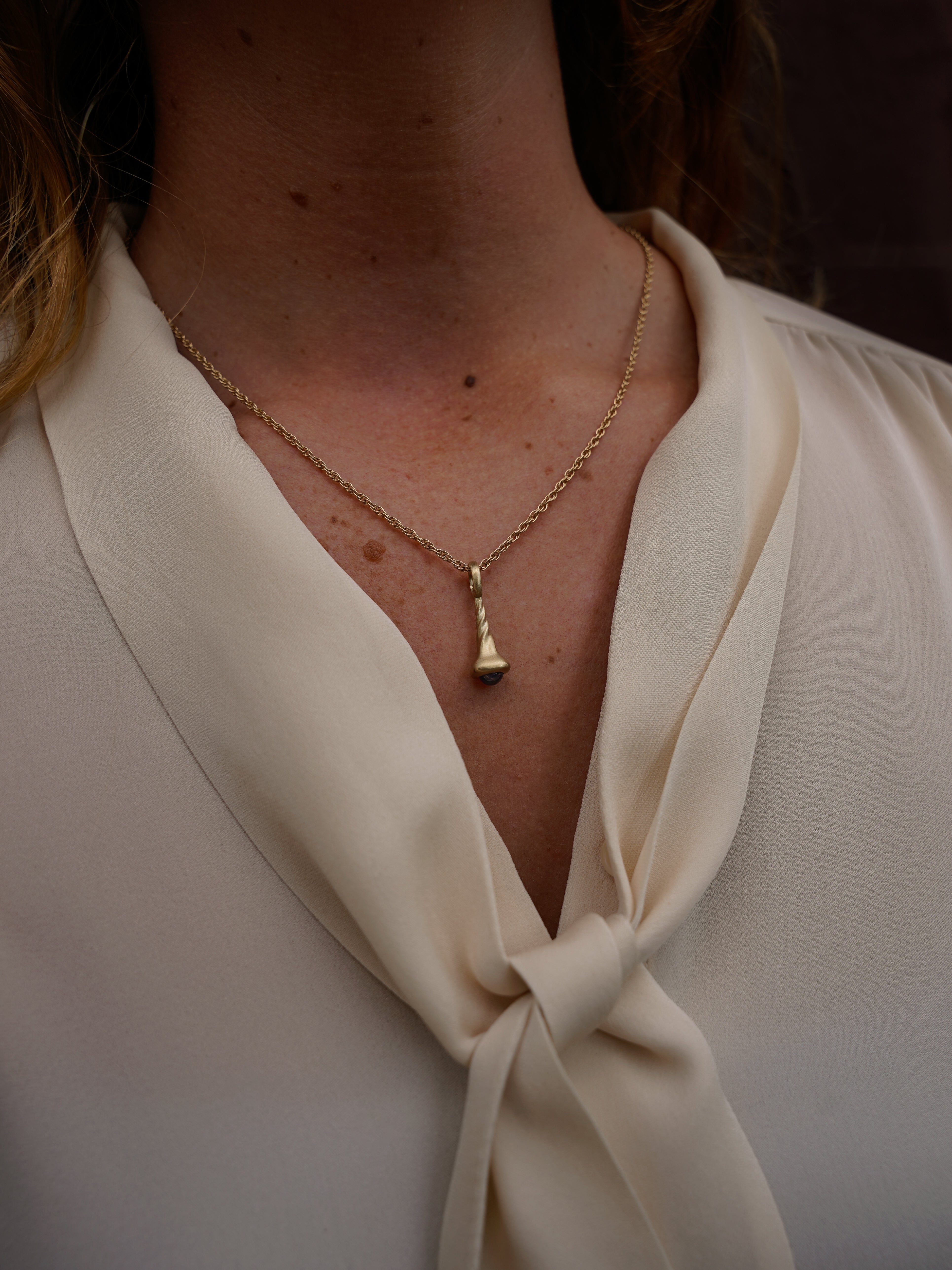 Okay Fine Gold Pendulum Charms On Model Small Blue Sapphire