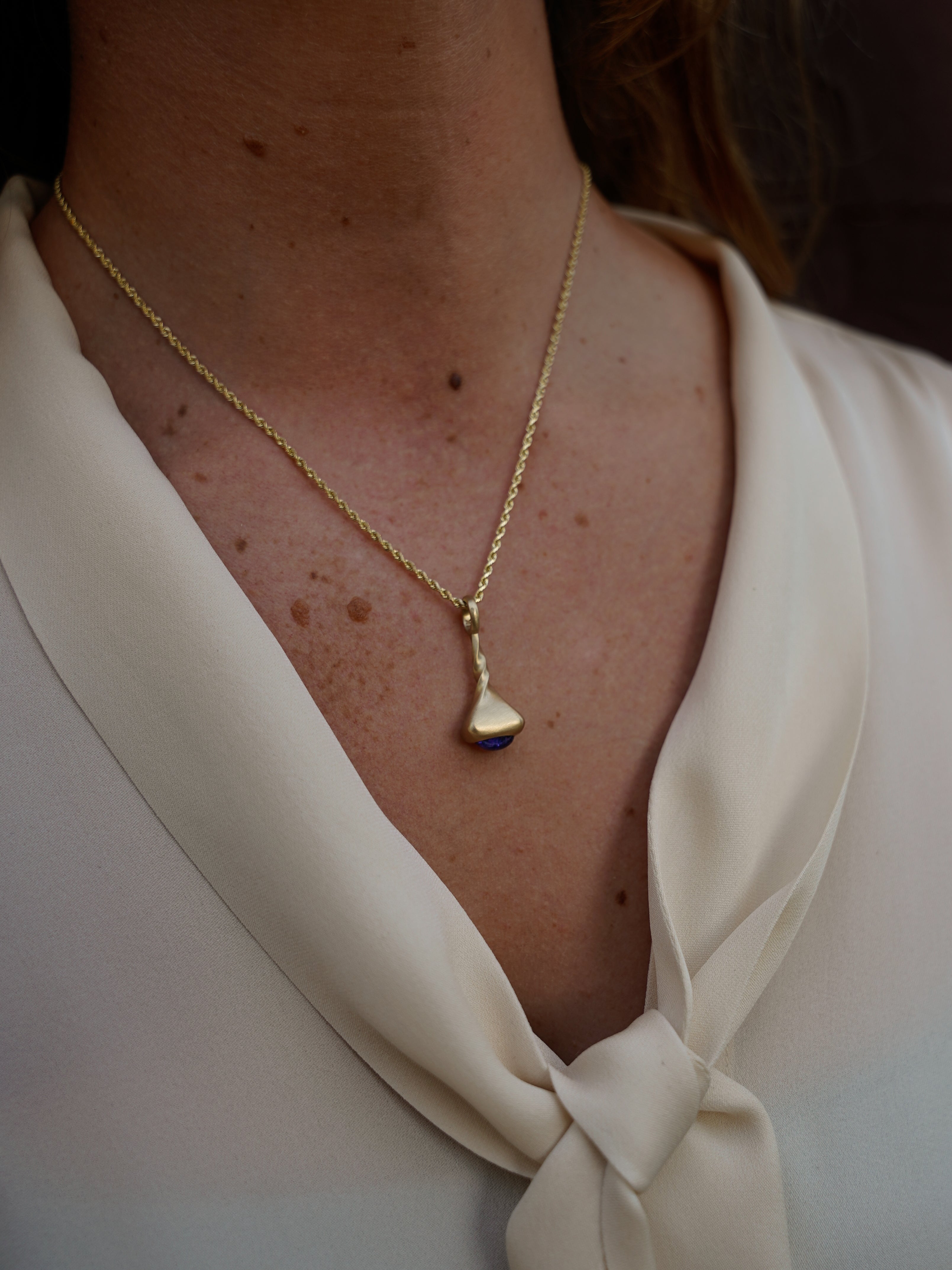 Okay Fine Gold Pendulum Charms On Model Tanzanite