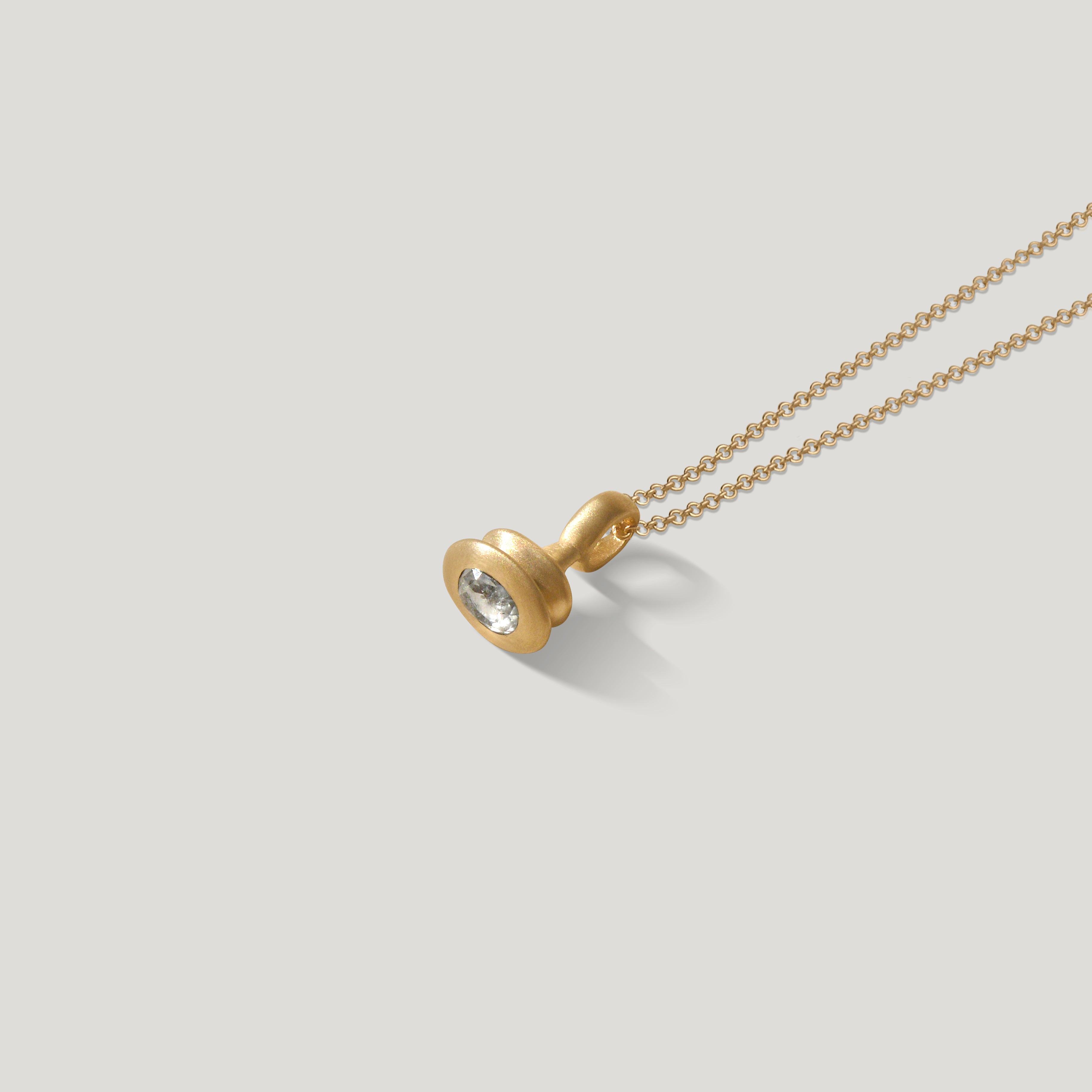 gold oval rose cut diamond pendulum charm no. 9 on 1.5mm cable chain on grey background