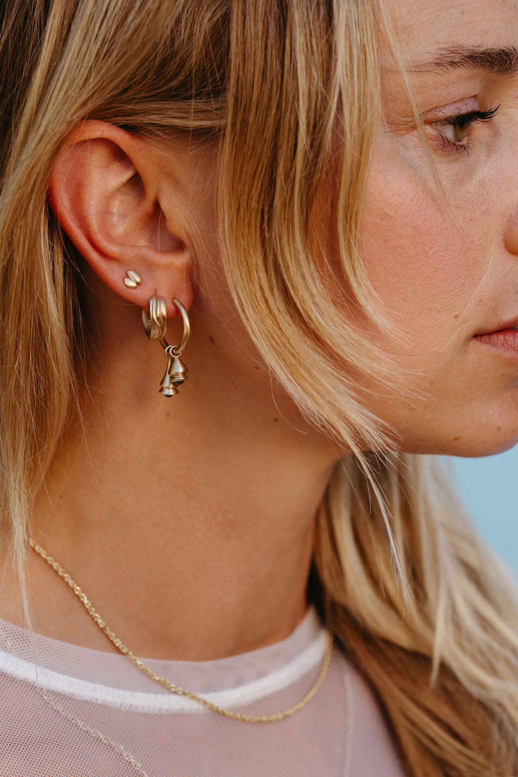 Emerald and Sapphire Pendulum Charm Hoop Earring - Gold in earring stack