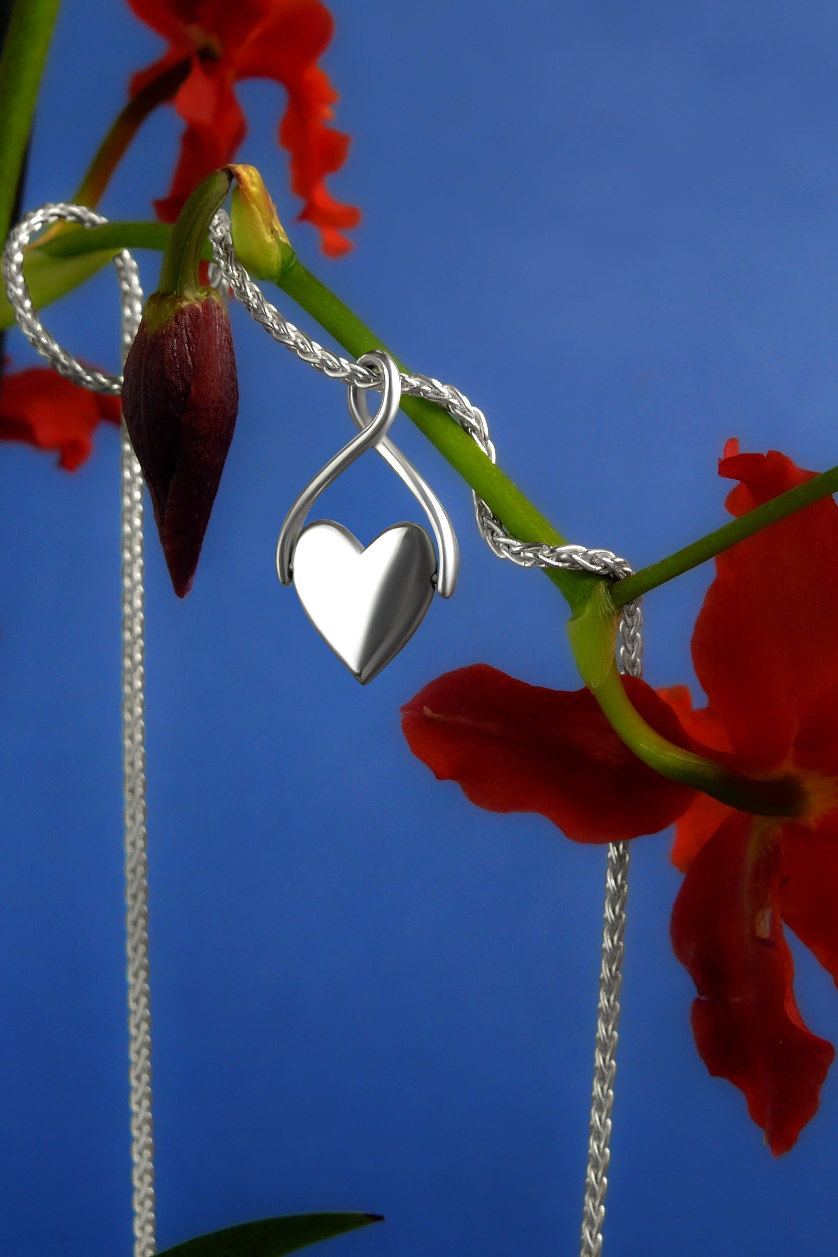 silver spinning heart charm on wheat chain