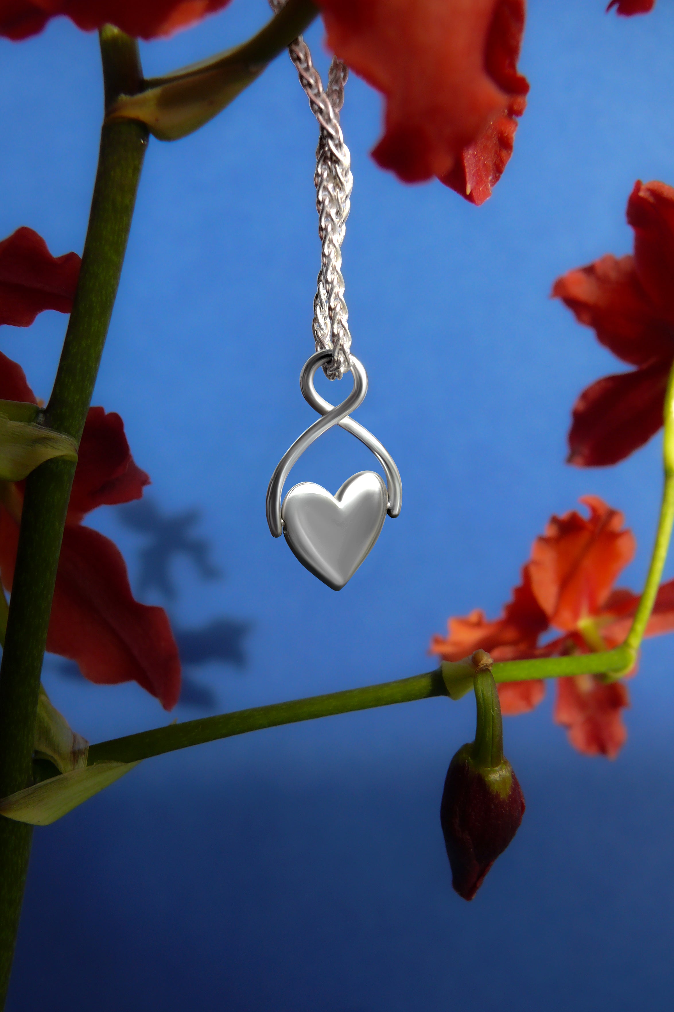 silver spinning heart charm on wheat chain