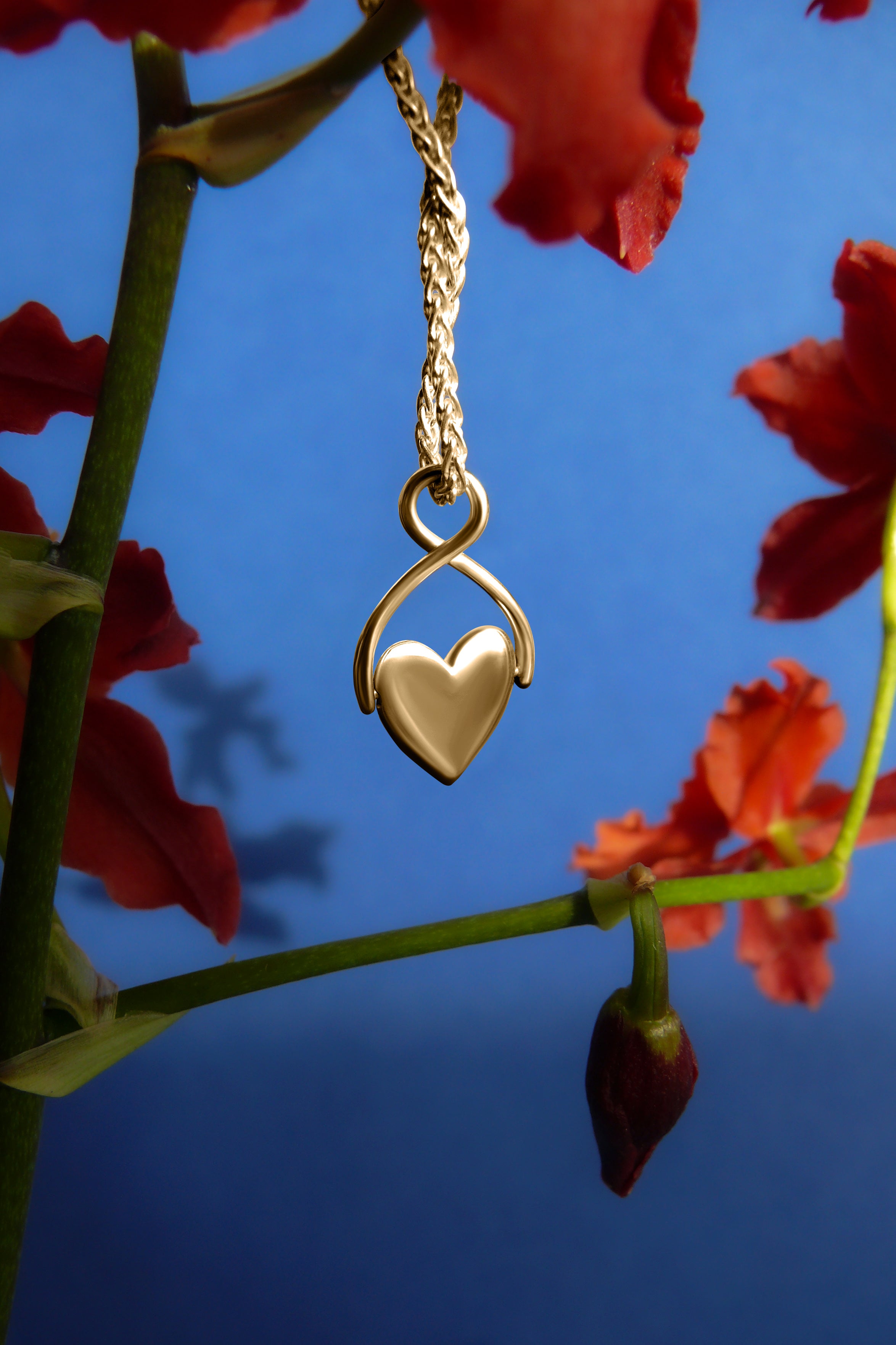 Gold Spinning Heart Necklace on wheat chain