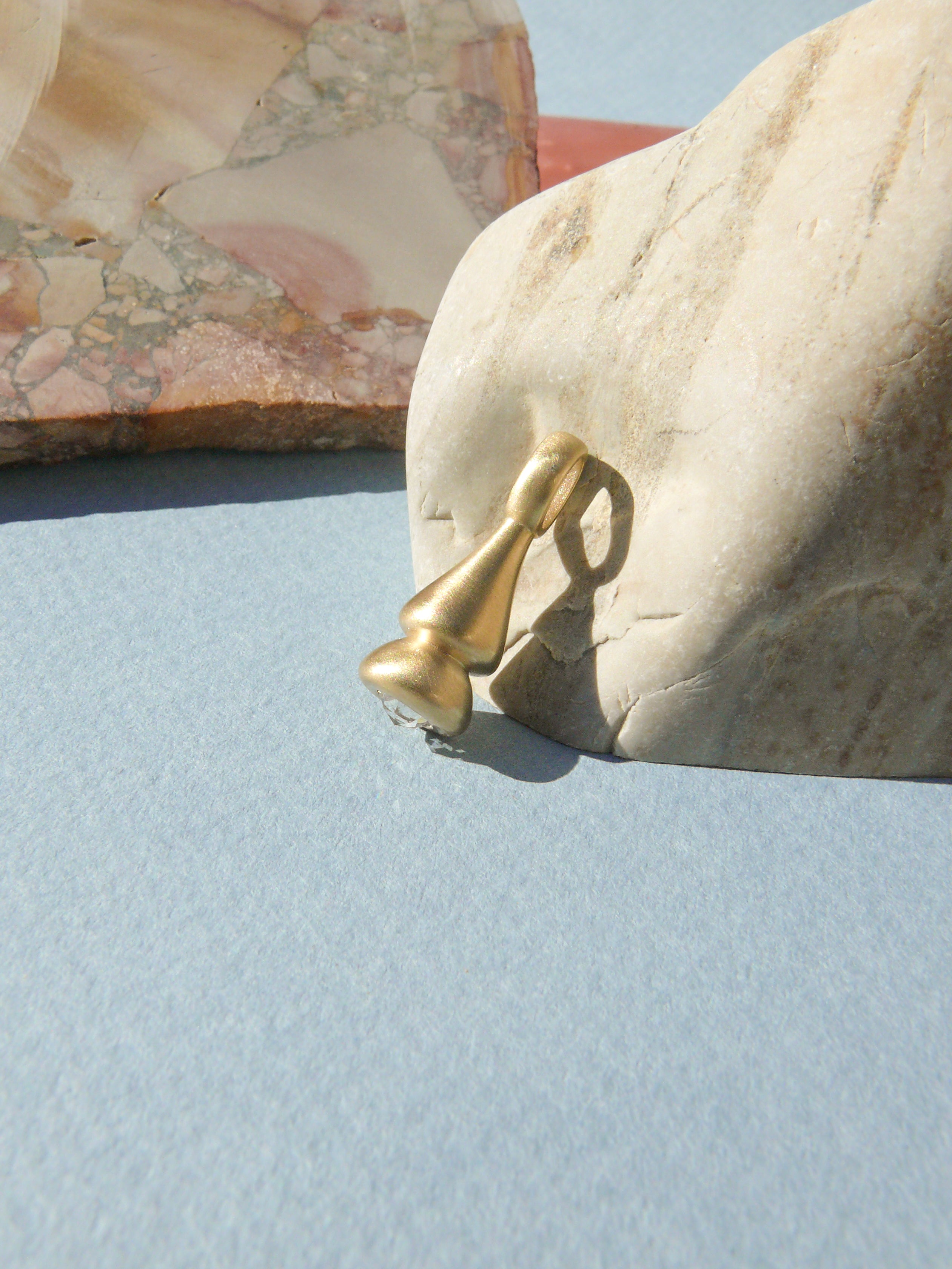 medium rose cut diamond pendulum charm no. 1 on rough rock