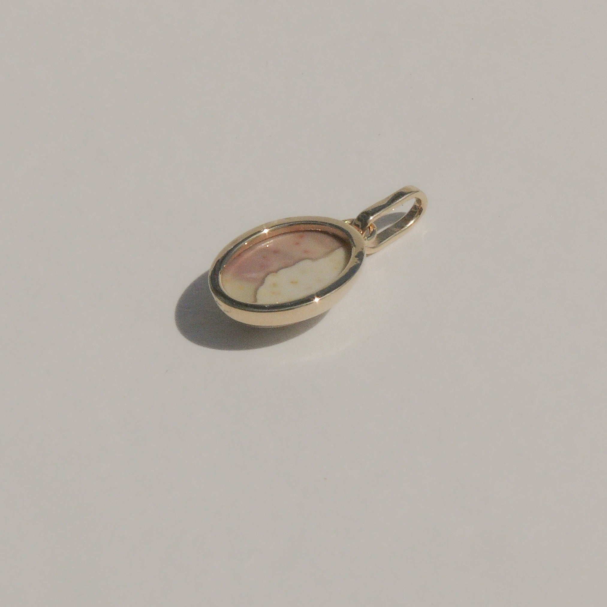 Gold Charm with a bezel set landscape jasper.