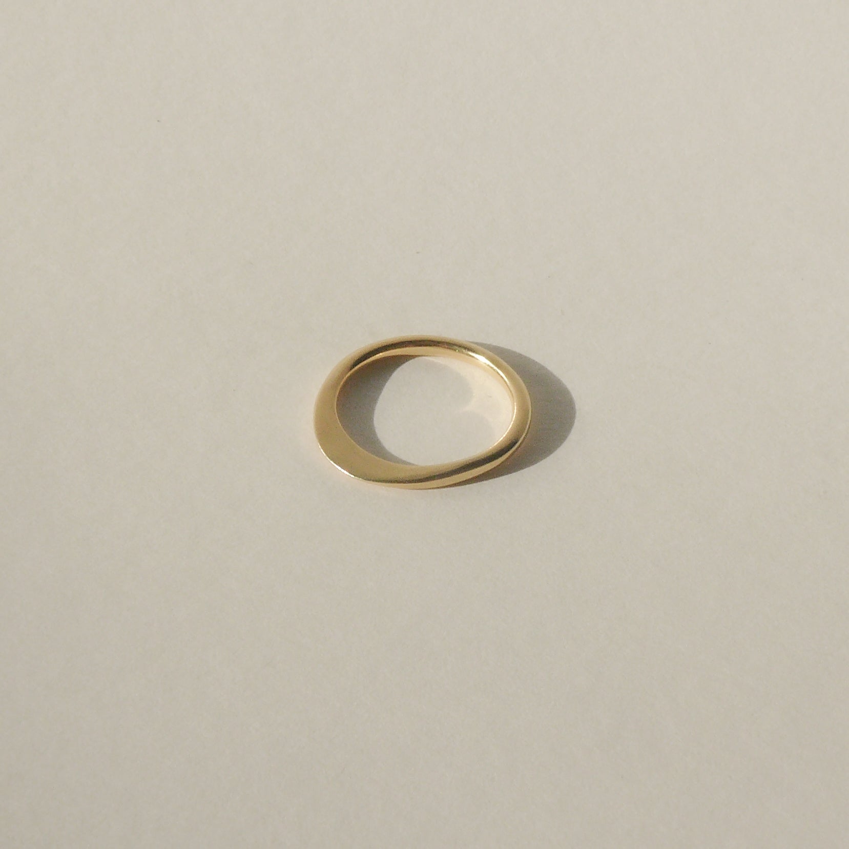 gold petite ridge ring on white with shadow