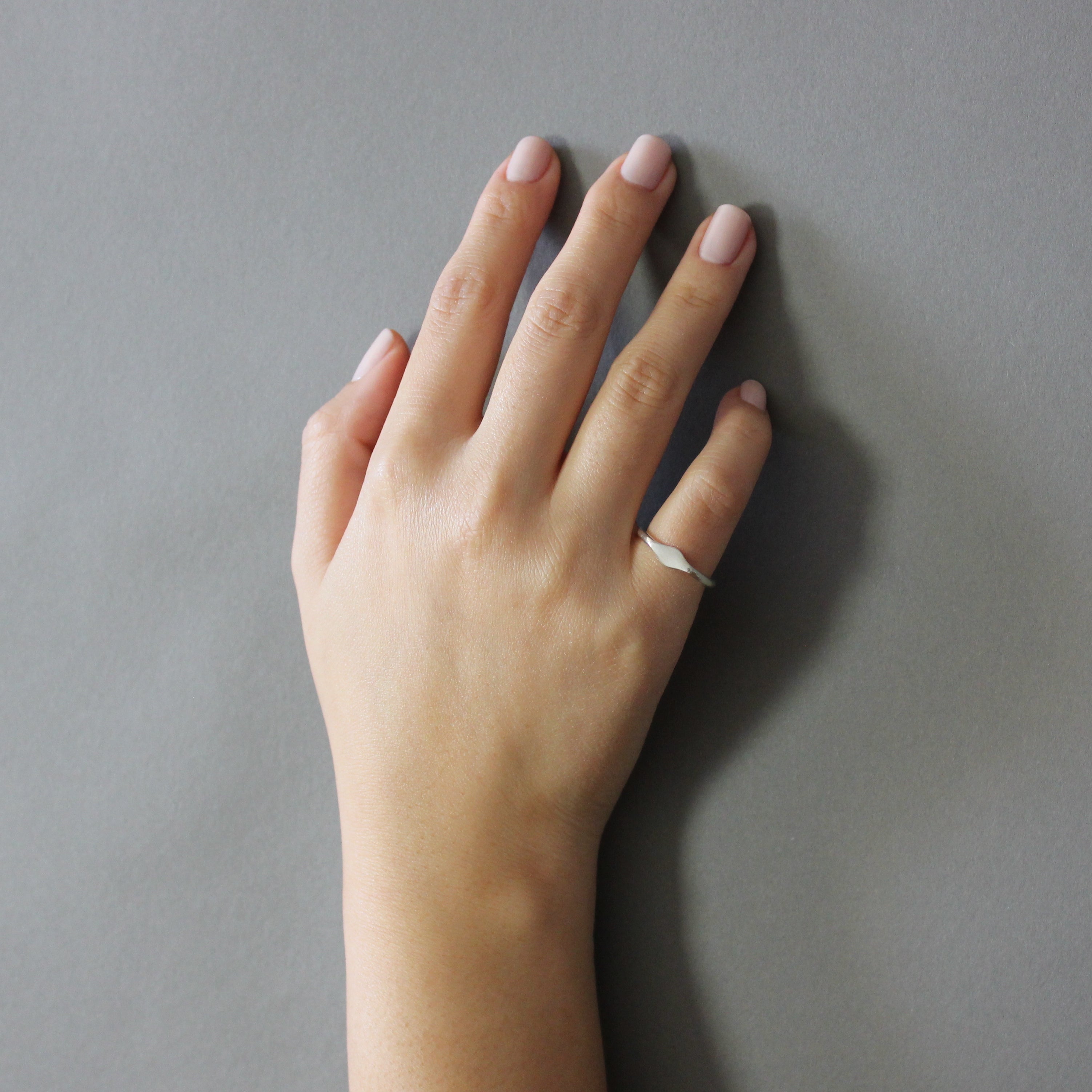 silver petite signet pinky ring on model